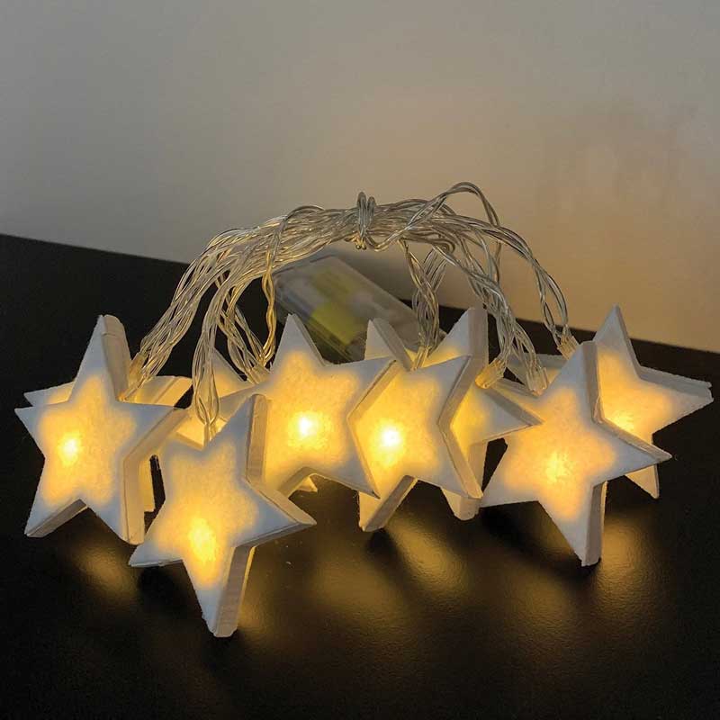 Cadena de luz de estrella de madera blanca