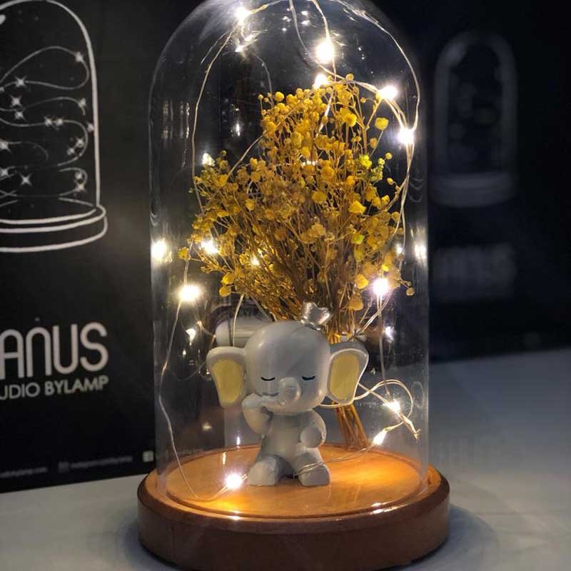 Illuminated Glass Fanus Yellow Ear Elephant and Flower Figure Lamp