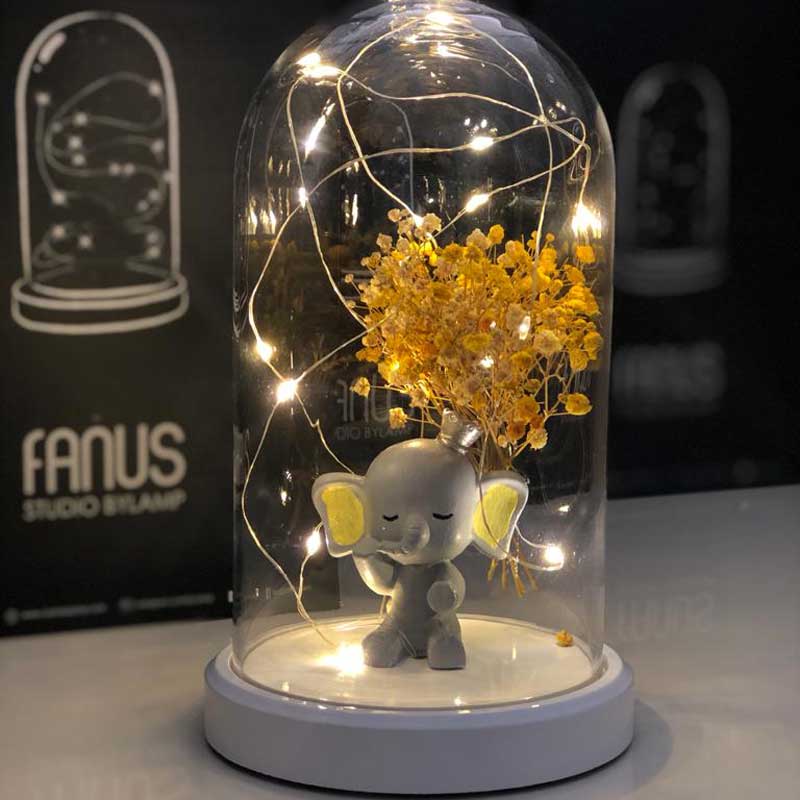 Illuminated Glass Fanus Yellow Ear Elephant and Flower Figure Lamp